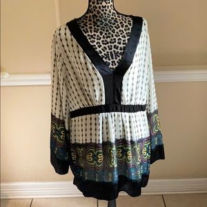 Beige and black tunic blouse w/ festive pattern